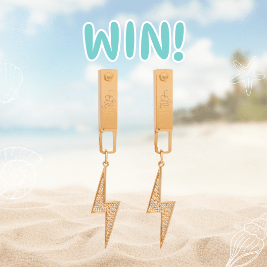 A pair of gold lightning bolt earrings stand upright in sandy beach foreground, with a blurred ocean and sky background. The word WIN! appears above the earrings, celebrating win jewelry. White shell illustrations decorate the image.